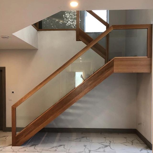White oak and glass staircase — Glass balustrade · oak handrail